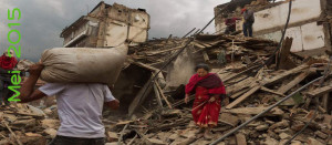 Nepal earthquake. Bhaktapur. A city near Katmandu. People reclaiming their possessions from the wreckage. A man who had been buried and died being pulled out of the wreckage by there Nepali Army rescue team. Sculpture of elephant in ruins  of an ancient, sacred temple. by James Nachtwey